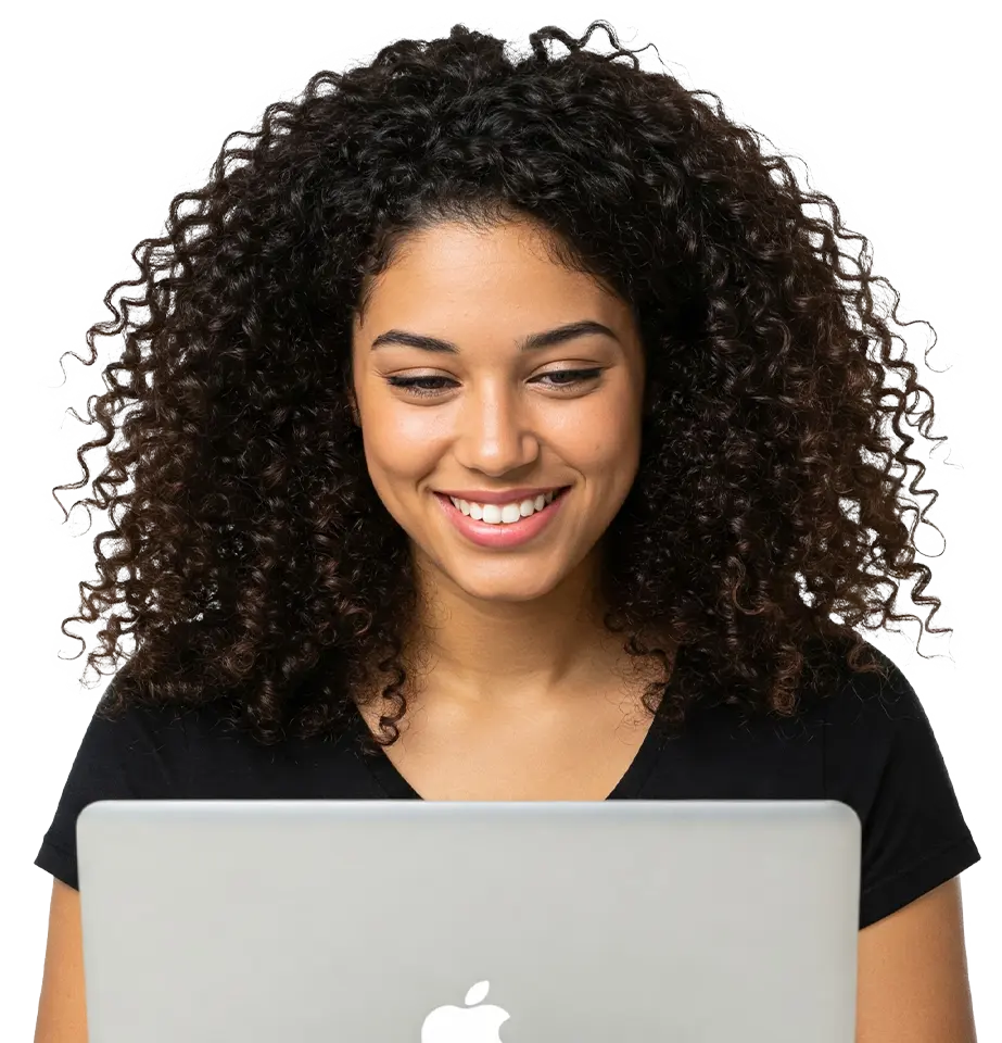 Woman using laptop while smiling