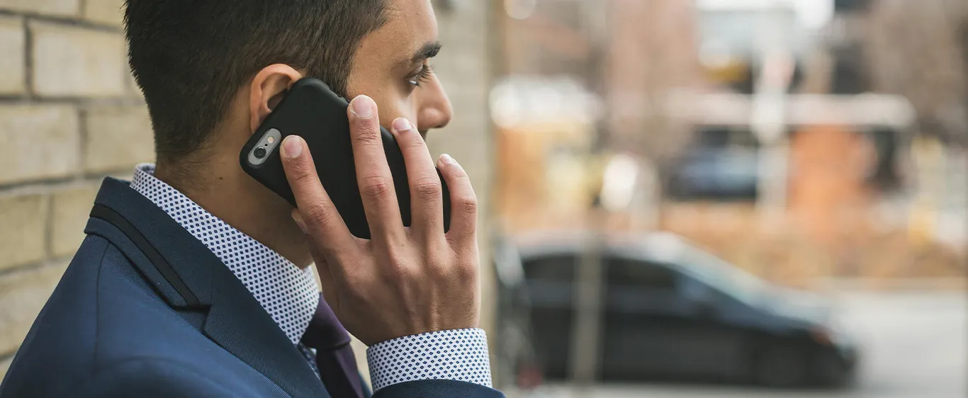 Well dressed man on phone talking to his marketing consultant